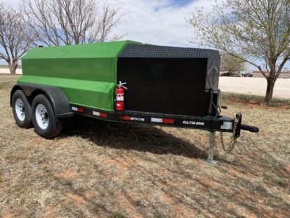 A green trailer with a black cover on it