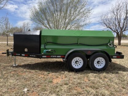 A green trailer with a black cover on it