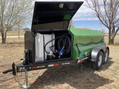 A green trailer with a black cover and a hose.