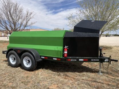 A green dump trailer with a black top.