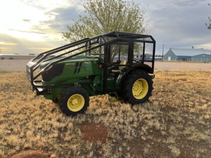 A tractor in the middle of an open field.