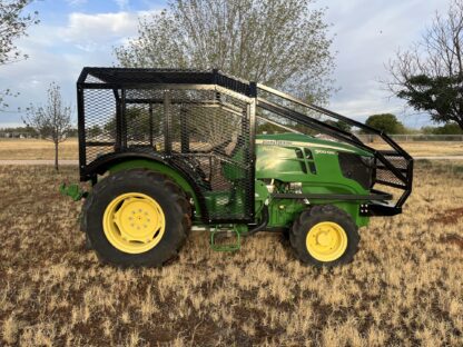 A tractor with a canopy on the back of it.