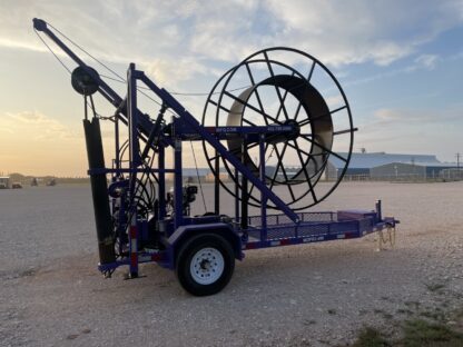 Large cable spool trailer at sunset.